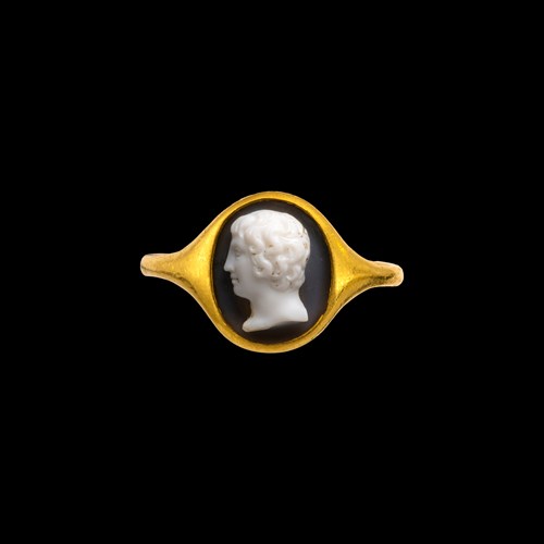 A high carat gold ring set with a Neoclassical onyx cameo. Portrait of a Youth.